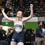 Soldotna's Kaytlin McAnelly celebrates winning the girls title at 132 pounds Saturday, Dec. 16, 2023, at the state wrestling tournament at the Alaska Airlines Center in Anchorage, Alaska. (Photo by Jeff Helminiak/Peninsula Clarion)