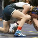 Soldotnas Valarie McAnelly works her way to a pin of Eagle Rivers Lauren Bodeen in the girls final at 107 pounds Saturday, Dec. 16, 2023, at the state wrestling tournament at the Alaska Airlines Center in Anchorage, Alaska. (Photo by Jeff Helminiak/Peninsula Clarion)