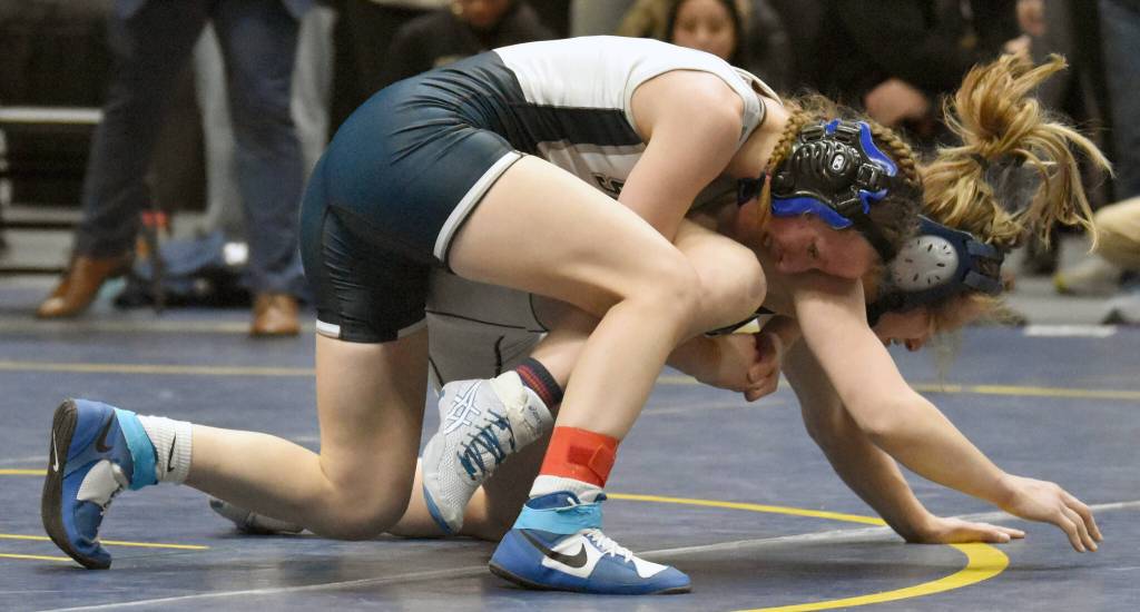 Soldotnas Valarie McAnelly works her way to a pin of Eagle Rivers Lauren Bodeen in the girls final at 107 pounds Saturday, Dec. 16, 2023, at the state wrestling tournament at the Alaska Airlines Center in Anchorage, Alaska. (Photo by Jeff Helminiak/Peninsula Clarion)
