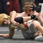 Souths Anan Siackhasone works his way to an 8-4 decision over Soldotnas Titus Watts in the Division I title match at 119 pounds Saturday, Dec. 16, 2023, at the state wrestling tournament at the Alaska Airlines Center in Anchorage, Alaska. (Photo by Jeff Helminiak/Peninsula Clarion)