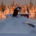 A snowmachine rider takes advantage of two feet of fresh snow on a field down Murwood Avenue in Soldotna, Alaska on Monday, Dec. 12, 2022. (Jake Dye/Peninsula Clarion)