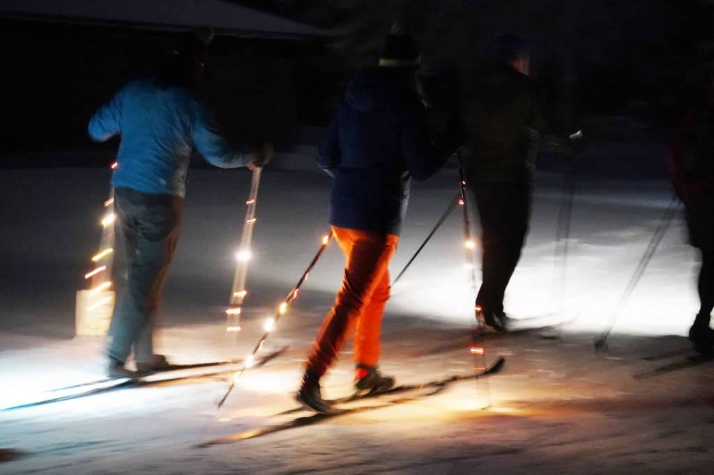 Skiers participate in the Third Annual StarLight StarBright winter solstice skiing fundraiser at the Kenai Golf Course in Kenai, Alaska, on Thursday, Dec. 21, 2023. (Jake Dye/Peninsula Clarion)