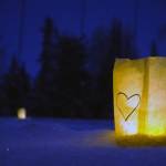 Luminaria light the path of the Third Annual StarLight StarBright winter solstice skiing fundraiser at the Kenai Golf Course in Kenai, Alaska, on Thursday, Dec. 21, 2023. (Jake Dye/Peninsula Clarion)