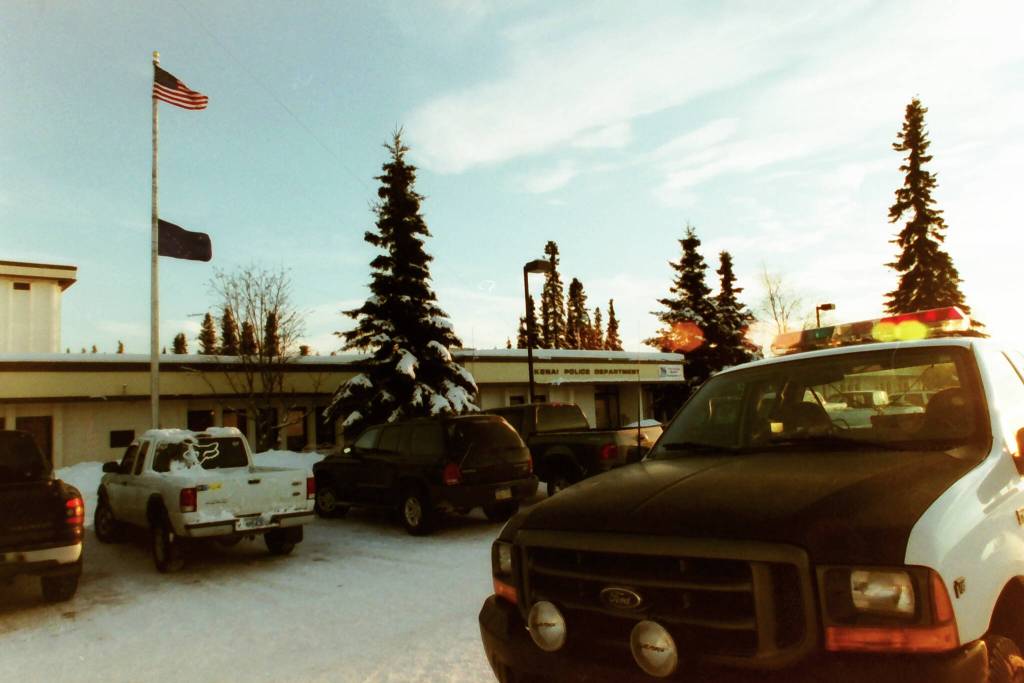 The Alaska State Flag is lowered to half-mast in honor of fallen officer John Watson in December, 2003. (Phil Hermanek/Peninsula Clarion)