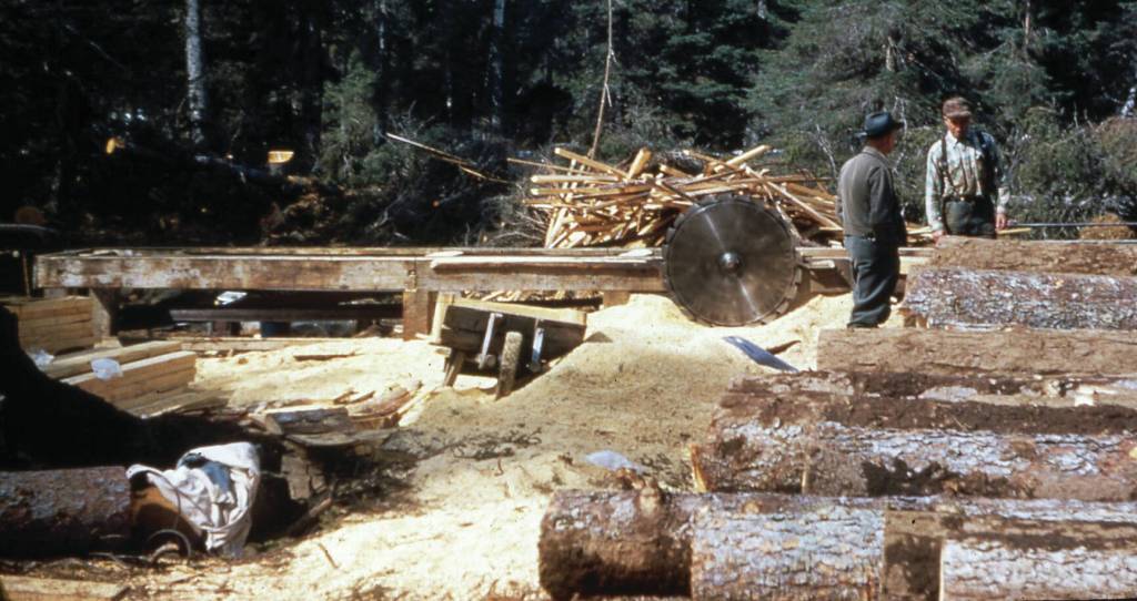 Louvie Vi Chapman photo courtesy of the Pratt Museum
Lawrence Keeler (right) talks at his Anchor Point sawmill with Sherman Champman in 1950. Keeler was cutting spruce logs for Chapmans home.