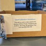A donation box for used calendars is displayed at M&M Market in Nikiski, Alaska, on Wednesday, Jan. 3, 2024. (Photo courtesy Toni Loop)