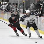 Soldotnas Boone Theiler protects the puck from Kenai Centrals Ethan Tree on Friday, Jan. 5, 2024, at the Soldotna Regional Sports Complex in Soldotna, Alaska. (Photo by Jeff Helminiak/Peninsula Clarion)
