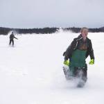 Jake Dye/Peninsula Clarion
Nathan Teates uses snowshoes to run across Headquarters Lake in the Kenai National Wildlife Refuge, pursued by Isaac Copple, near Soldotna on Saturday.