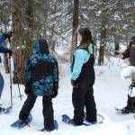Park Ranger Leah Eskelin, right, takes questions while leading a snowshoe walk at the Kenai National Wildlife Refuge near Soldotna, Alaska, on Saturday, Jan. 6, 2024. (Jake Dye/Peninsula Clarion)