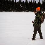 Airk Furseth takes photos while snowshoeing on Headquarters Lake in the Kenai National Wildlife Refuge near Soldotna, Alaska, on Saturday, Jan. 6, 2024. (Jake Dye/Peninsula Clarion)