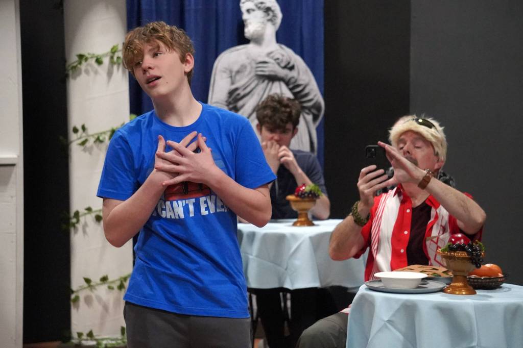 Gage Sturman portrays Narcissus and Todd Sherwood portrays Sparky Guy during a rehearsal of Greece is the Word: The Zeusical at the Kenai Performers Theatre in Soldotna, Alaska, on Saturday, Jan. 6, 2024. (Jake Dye/Peninsula Clarion)