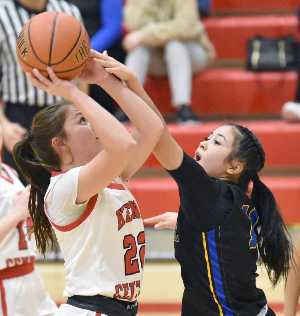 Kenai Centrals Emilee Wilson puts up a shot against Bethels Isabel Lieb on Wednesday, Jan. 10, 2024, at Kenai Central High School in Kenai, Alaska. (Photo by Jeff Helminiak/Peninsula Clarion)