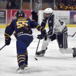 Soldotnas Daniel Heath makes a move on Homers Ethan Drake on Thursday, Jan. 18, 2024, at the Soldotna Regional Sports Complex in Soldotna, Alaska. (Photo by Jeff Helminiak/Peninsula Clarion)
