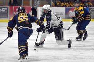 Soldotna's Daniel Heath makes a move on Homer's Ethan Drake on Thursday, Jan. 18, 2024, at the Soldotna Regional Sports Complex in Soldotna, Alaska. (Photo by Jeff Helminiak/Peninsula Clarion)