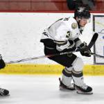 Nick Stevens of the Kenai River Brown Bears protects the puck from Carter Theissen of the Wisconsin Windigo on Saturday, Jan. 20, 2024, at the Soldotna Regional Sports Complex in Soldotna, Alaska. (Photo by Jeff Helminiak/Peninsula Clarion)