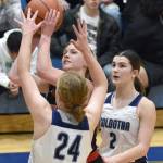Kenai Centrals Mycka Phillips shoots over Soldotnas Hope Hillyer and in front of Soldotnas Anaulie Sedivy at the Revolution Sport and Spine Therapy Al Howard Shootout on Thursday, Jan. 25, 2024, at Soldotna High School in Soldotna, Alaska. (Photo by Jeff Helminiak/Peninsula Clarion)