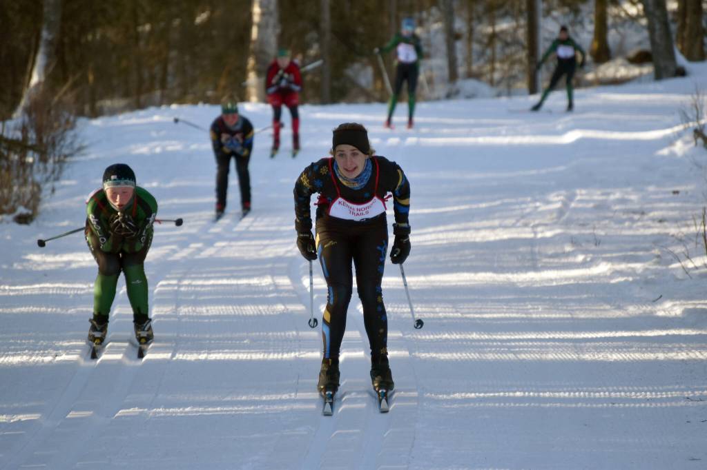 Homers Daisy MossWalker coasts down a hill at the Kardinal Klassic on Friday, Jan. 26, 2024, at Tsalteshi Trails just outside of Soldotna, Alaska. (Photo by Jeff Helminiak/Peninsula Clarion)