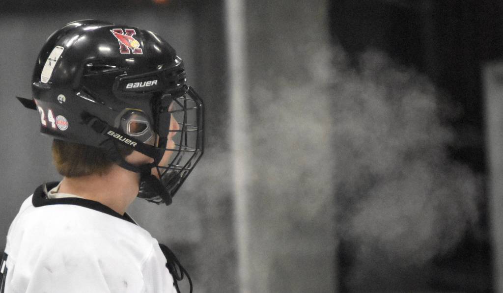 Kenai Centrals Avery Martin exhales into the frigid air Friday, Jan. 26, 2024, at the Kenai Multi-Purpose Facility in Kenai, Alaska. (Photo by Jeff Helminiak/Peninsula Clarion)