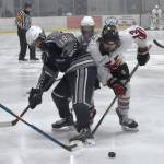 Soldotnas Marshall Deraeve and Kenai Centrals Will Howard battle for the puck Friday, Jan. 26, 2024, at the Kenai Multi-Purpose Facility in Kenai, Alaska. (Photo by Jeff Helminiak/Peninsula Clarion)