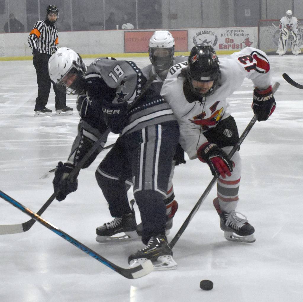 Soldotnas Marshall Deraeve and Kenai Centrals Will Howard battle for the puck Friday, Jan. 26, 2024, at the Kenai Multi-Purpose Facility in Kenai, Alaska. (Photo by Jeff Helminiak/Peninsula Clarion)