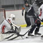 Kenai Central goalie Evyn Witt makes a save against Soldotna on Friday, Jan. 26, 2024, at the Kenai Multi-Purpose Facility in Kenai, Alaska. (Photo by Jeff Helminiak/Peninsula Clarion)