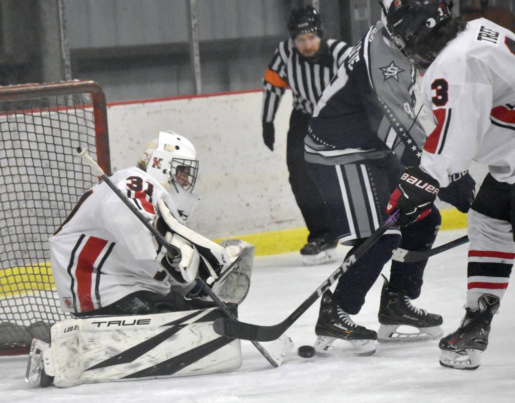 Kenai Central goalie Evyn Witt makes a save against Soldotna on Friday, Jan. 26, 2024, at the Kenai Multi-Purpose Facility in Kenai, Alaska. (Photo by Jeff Helminiak/Peninsula Clarion)