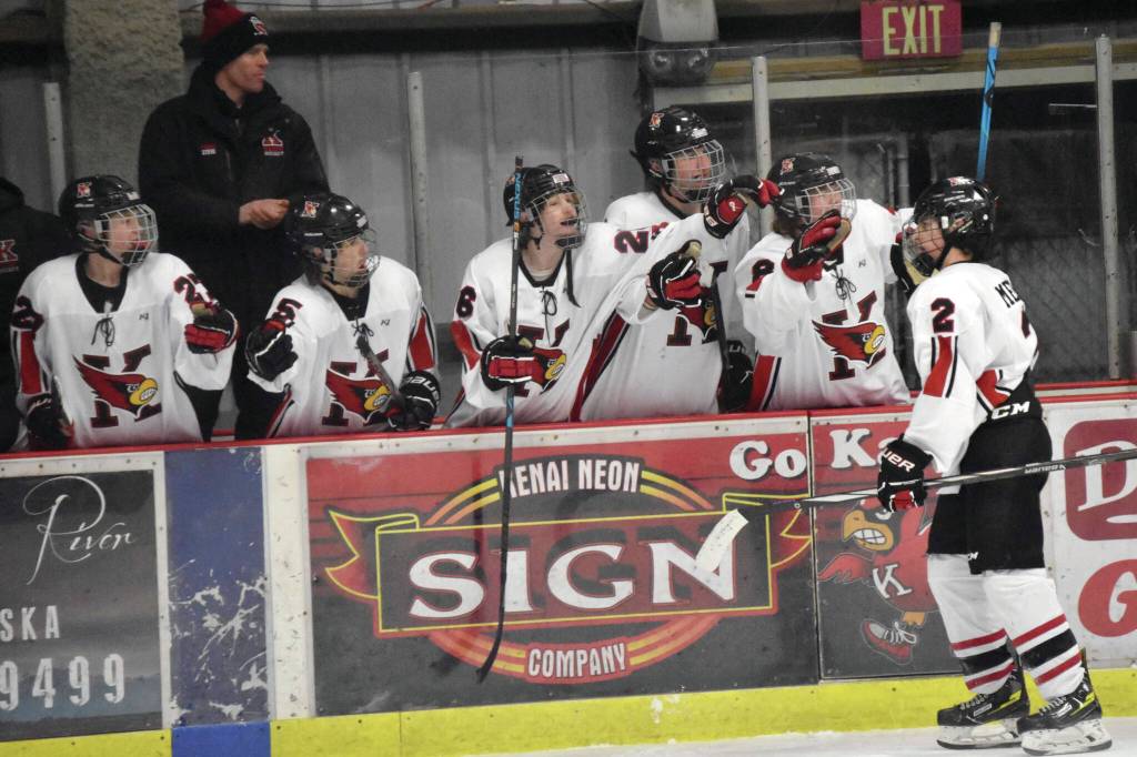 Kenai Centrals Logan Mese celebrates after clinching the game with an empty-net goal Friday, at the Kenai Multi-Purpose Facility. (Photo by Jeff Helminiak/Peninsula Clarion)