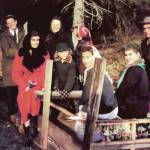Members of the Keeler family and some Anchor Point church members get a ride on Jimmy Elliots mud sled on the way to services at the Elliot home, circa 1956. Lorna Keeler is sitting on the far-left side of the sled. April Keeler is the middle girl of the trio sitting in back, and Larry Keeler is standing behind those girls. (Photo courtesy of the Pratt Museum)