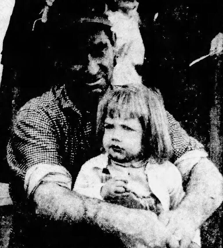 Bob Keeler and his daughter Sandra relax at October 1956 festival in rural Oregon. (Photo from The World, Coos Bay, Oregon)