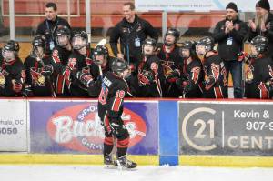 Kenai Central's Sawyer Vann celebrates his game-clinching, empty-net goal Thursday, Feb. 1, 2024, at the Division II state hockey tournament at the Soldotna Regional Sports Complex in Soldotna, Alaska. (Photo by Jeff Helminiak/Peninsula Clarion)