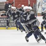 Soldotnas Jace Appelhans (front of pack) celebrates his game-winning goal over Palmer in overtime at the Division II state tournament Friday, Feb. 2, 2024, at the Soldotna Regional Sports Complex in Soldotna, Alaska. (Photo by Jeff Helminiak/Peninsula Clarion)