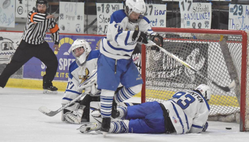 The game-winning goal from Soldotnas Jace Appelhans sits in the net behind Palmers Keagon OBryan, Ryan Martin and Kaleb Von Gunten at the Division II state tournament Friday, Feb. 2, 2024, at the Soldotna Regional Sports Complex in Soldotna, Alaska. (Photo by Jeff Helminiak/Peninsula Clarion)