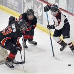 Kenai Centrals Will Howard and Ethan Tree defend Houstons Daniel Matveev at the Division II state tournament Friday, Feb. 2, 2024, at the Soldotna Regional Sports Complex in Soldotna, Alaska. (Photo by Jeff Helminiak/Peninsula Clarion)