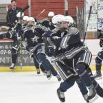 Soldotna's Jace Appelhans (front of pack) celebrates his game-winning goal over Palmer in overtime at the Division II state tournament Friday, Feb. 2, 2024, at the Soldotna Regional Sports Complex in Soldotna, Alaska. (Photo by Jeff Helminiak/Peninsula Clarion)