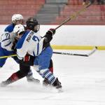 Palmers Nathanael Wright and Ryan Martin keep Kenai Centrals Avery Martin from getting the puck at the Division II state hockey tournament Saturday, Feb. 3, 2024, at the Soldotna Regional Sports Complex in Soldotna, Alaska. (Photo by Jeff Helminiak/Peninsula Clarion)