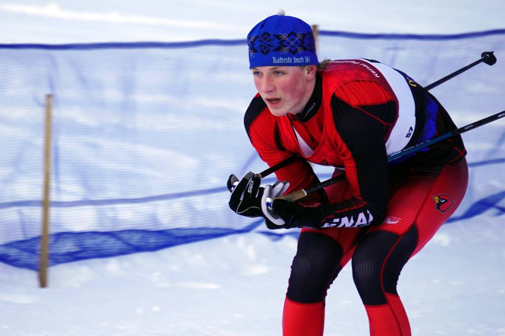Kenai Centrals Chase Laker tucks as he moves into the finish chute during the Region III Boys 7.5K Classic Race at Tsalteshi Trails near Soldotna, Alaska, on Saturday, Feb. 10, 2024. (Jake Dye/Peninsula Clarion)
