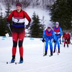 Kenai Centrals Emily Moss leads a pack of skiers early during the Region III Girls 7.5K Classic Race at Tsalteshi Trails near Soldotna, Alaska, on Saturday, Feb. 10, 2024. (Jake Dye/Peninsula Clarion)