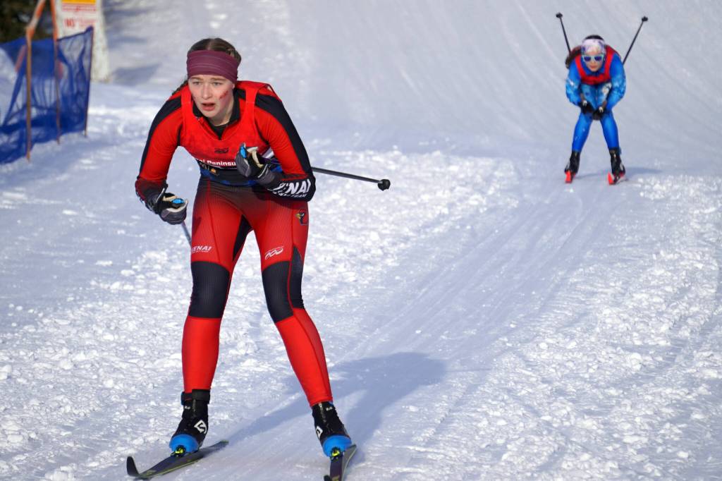 Kenai Centrals Emily Moss leads Soldotnas Kathryn Cox as both move into the finish chute during the Region III Girls 7.5K Classic Race at Tsalteshi Trails near Soldotna, Alaska, on Saturday, Feb. 10, 2024. (Jake Dye/Peninsula Clarion)
