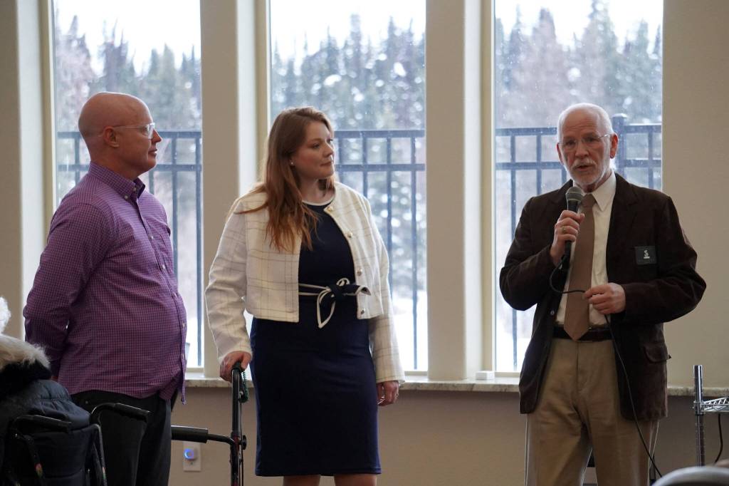 Aspen Creek Senior Living CEO Doug Clegg and Executive Director Ashley Nichols listen as Soldotna Mayor Paul Whitney speaks during a grand opening event at Aspen Creek Senior Living in Soldotna, Alaska, on Friday, Feb. 9, 2024. (Jake Dye/Peninsula Clarion)