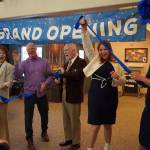 Soldotna Mayor Paul Whitney, center, and representatives of Aspen Creek Senior Living celebrate a ribbon cutting during a grand opening event at Aspen Creek Senior Living in Soldotna, Alaska, on Friday, Feb. 9, 2024. (Jake Dye/Peninsula Clarion)