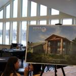 A board displaying an upcoming addition to the Soldotna Aspen Creek Senior Living location is showcased during a grand opening event at Aspen Creek Senior Living in Soldotna, Alaska, on Friday, Feb. 9, 2024. (Jake Dye/Peninsula Clarion)