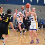 Cook Inlet Academys Kristi Stoll readies for a pass, backed by Gabrielle Viefield, as Aniaks Adrian Murphy and Sierra Lang move to defend during a basketball game at Cook Inlet Academy in Soldotna, Alaska, on Tuesday, Feb. 13, 2024. (Jake Dye/Peninsula Clarion)