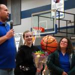 Cook Inlet Academys Mackenzie Carson stands with her family and coach Josh Hawley as shes honored during senior night festivities at Cook Inlet Academy in Soldotna, Alaska, on Tuesday, Feb. 13, 2024. (Jake Dye/Peninsula Clarion)