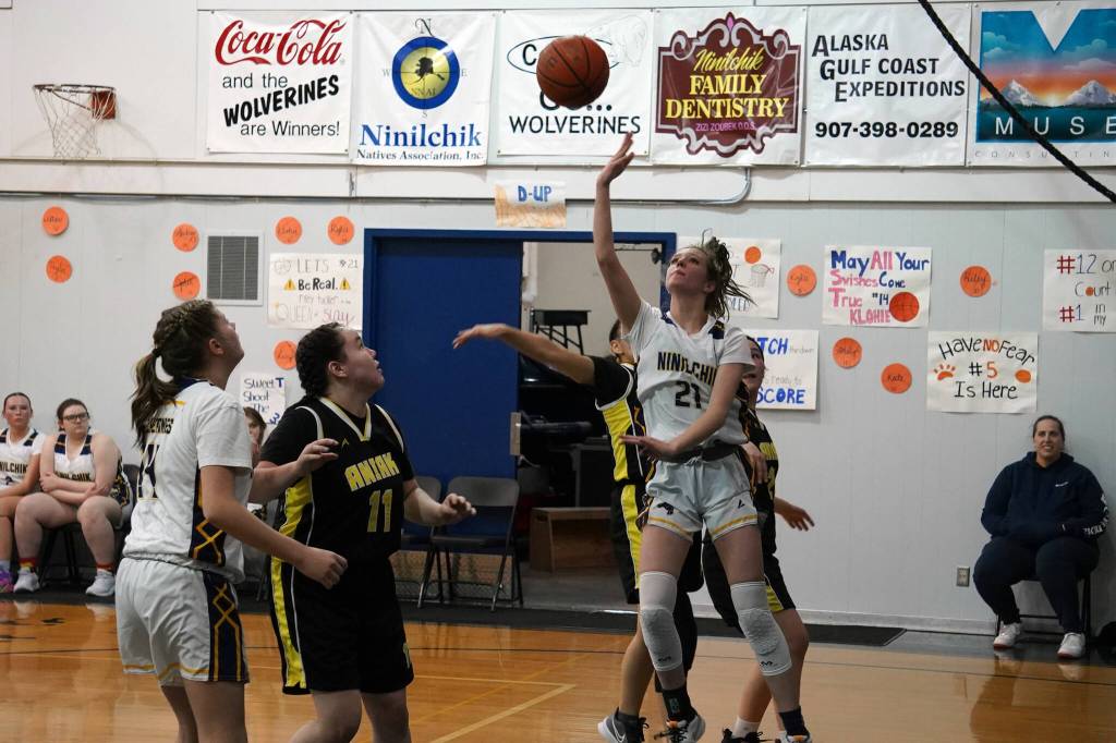 Ninilchiks Riley Tucker leaps to shoot a basket during a basketball game at Ninilchik School in Ninilchik, Alaska, on Wednesday, Feb. 14, 2024. (Jake Dye/Peninsula Clarion)
