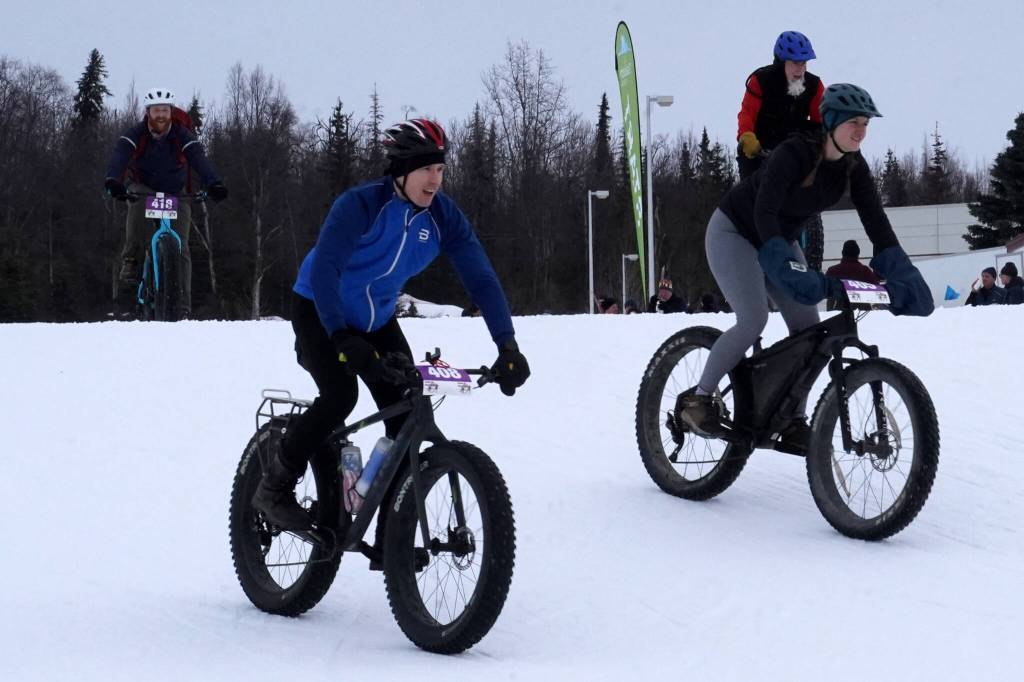 Jeffrey Hall and Rebecca Fisher set out on the 20-kilometer fat bike race during the Tour of Tsalteshi at Tsalteshi Trails near Soldotna, Alaska, on Sunday, Feb. 18, 2024. (Jake Dye/Peninsula Clarion)