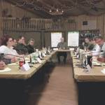 People identifying as Democrats and people identifying as Republicans sit face to face during a workshop put on by Braver Angels in this screenshot from Braver Angels: Reuniting America. (Screenshot courtesy Braver Angels)