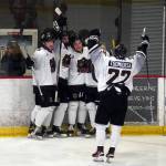 The Kenai River Brown Bears celebrate a goal by Dylan Contreras, center, during a hockey game at the Soldotna Regional Sports Complex in Soldotna, Alaska, on Friday, Feb. 23, 2024. (Jake Dye/Peninsula Clarion)