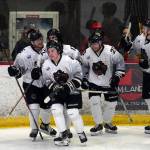 The Kenai River Brown Bears celebrate a goal by Dylan Contreras, center, during a hockey game at the Soldotna Regional Sports Complex in Soldotna, Alaska, on Friday, Feb. 23, 2024. (Jake Dye/Peninsula Clarion)