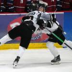 Kenai Rivers Brady Engelkes celebrates a hat trick with his teammates during a game against Fairbanks at the Soldotna Regional Sports Complex in Soldotna, Alaska, on Saturday, Feb. 24, 2024. (Jake Dye/Peninsula Clarion)