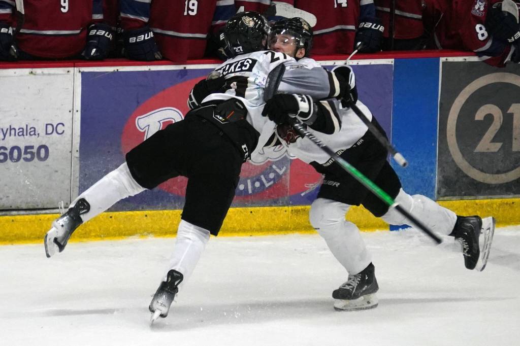 Kenai Rivers Brady Engelkes celebrates a hat trick with his teammates during a game against Fairbanks at the Soldotna Regional Sports Complex in Soldotna, Alaska, on Saturday, Feb. 24, 2024. (Jake Dye/Peninsula Clarion)